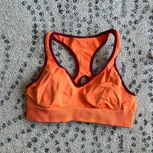 Lululemon go steady sports bra orange racer back red trim